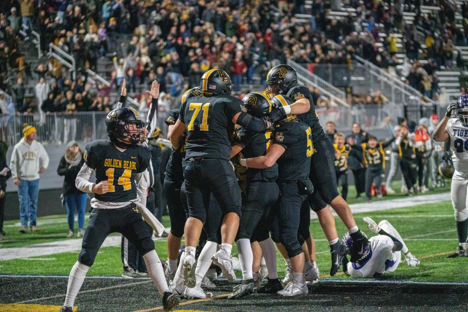 Upper Arlington celebrates its 23-17 triple-overtime win over visiting Pickerington Central on Friday in a Division I, Region 3 quarterfinal.