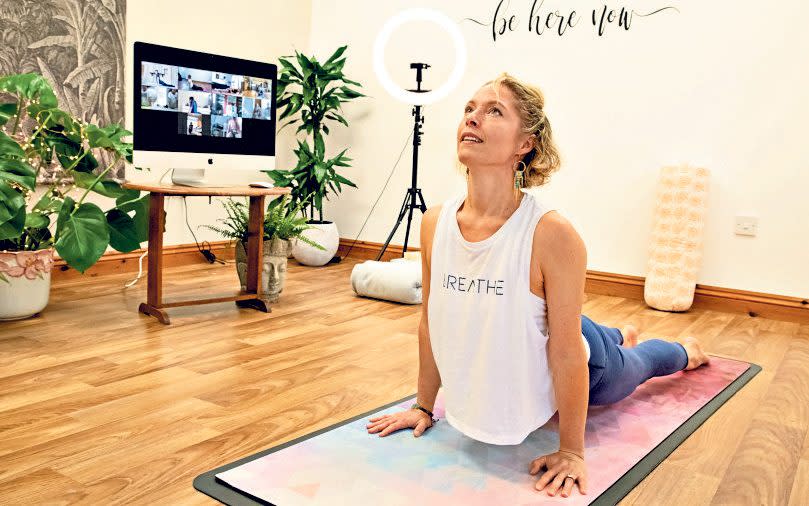 Lizzie Ward teaching yoga to teens via Zoom from her home studio in Northamptonshire -  Andrew Fox