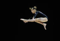 At 15 years old, Rebecca Tunney of Great Britain in action on the balance beam during the Women's Artistic Gymnastics Olympic Qualification round at North Greenwich Arena on January 11, 2012 in London, England. (Paul Gilham/Getty Images)