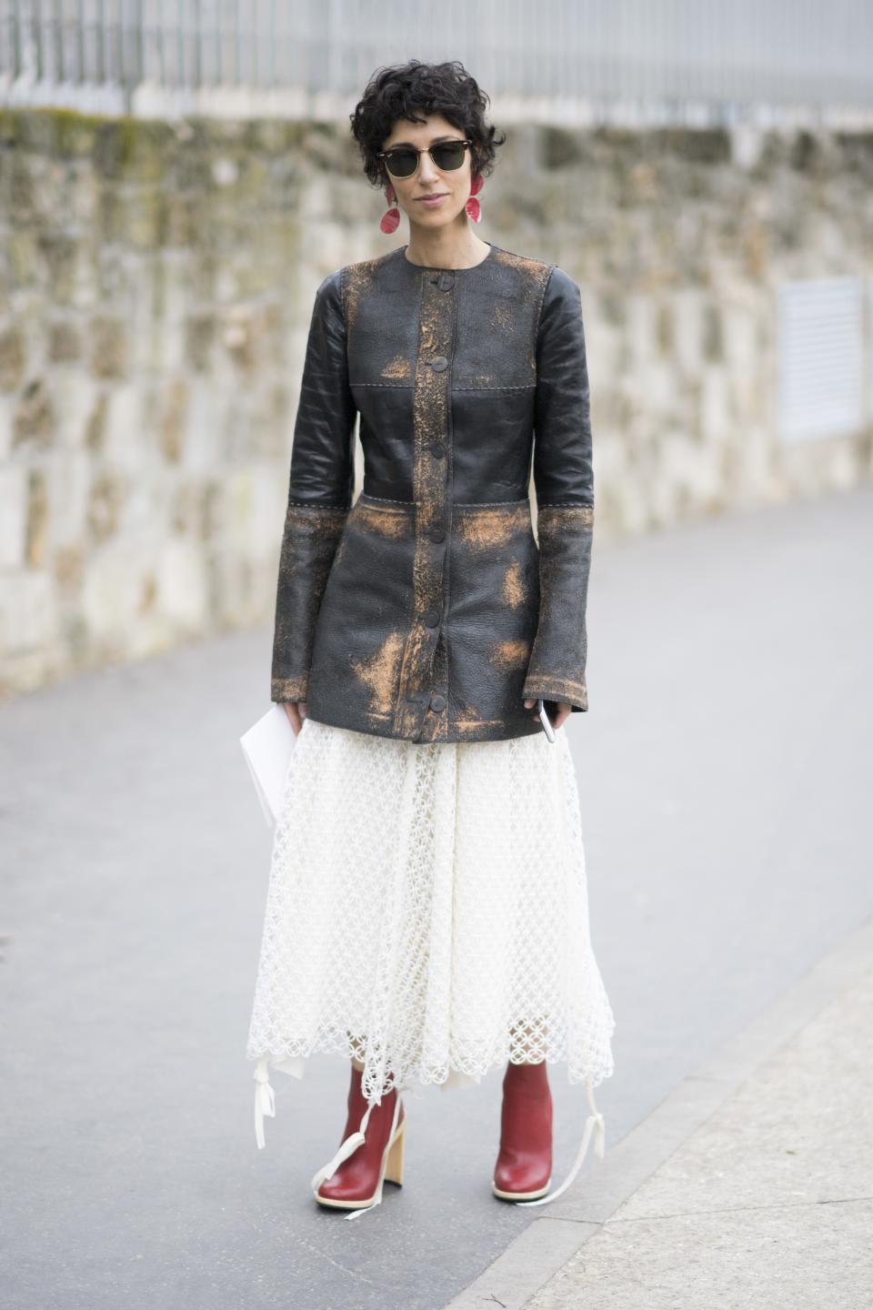 A pretty lace skirt feels a lot less serious when you play it down with a distressed leather jacket and red ankle boots.