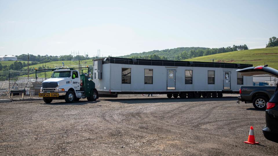 UCOR began designing the infrastructure for a new base of operations for cleanup at the Y-12 National Security Complex last fall, and construction started earlier this year. Employees bring trailers to the new location to provide needed workspace to support cleanup crews.