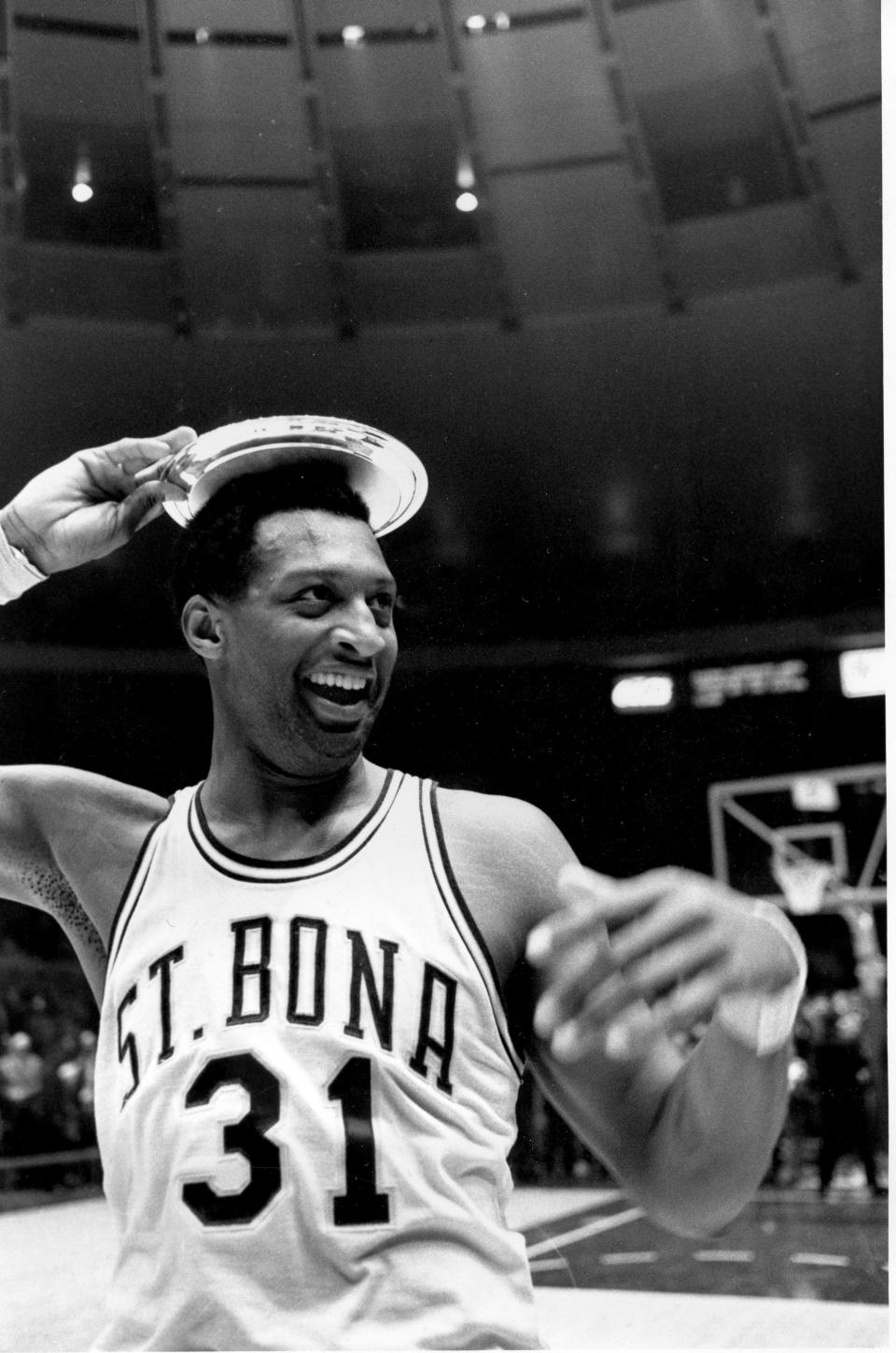 Bob Lanier of St. Bonaventure puts his MVP trophy on his head after his team won the ECAC Holiday Festival basketball tournament at New York's Madison Square Garden on Dec. 31, 1969.  St. Bona defeated Purdue 91-75.