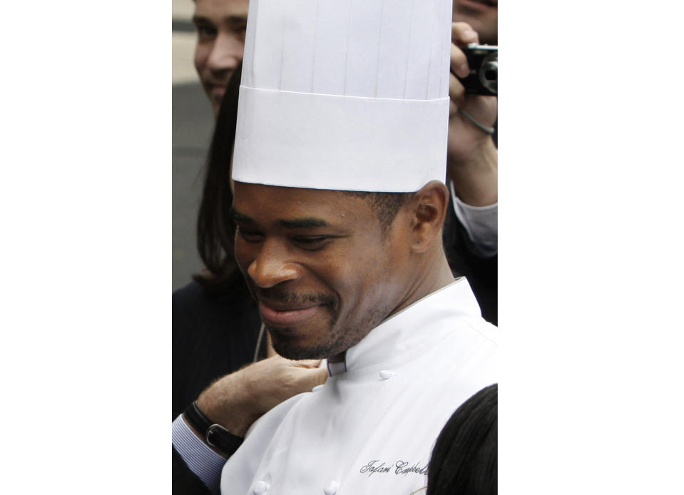 FILE - White House Chef Tafari Campbell smiles, Nov. 6, 2008, on the South Lawn of the White House in Washington. On Friday, July 28, 2023, The Associated Press reported on stories circulating online incorrectly claiming Campbell was found dead on the anniversary of Jeffrey Epstein’s death. (AP Photo/Ron Edmonds, File)