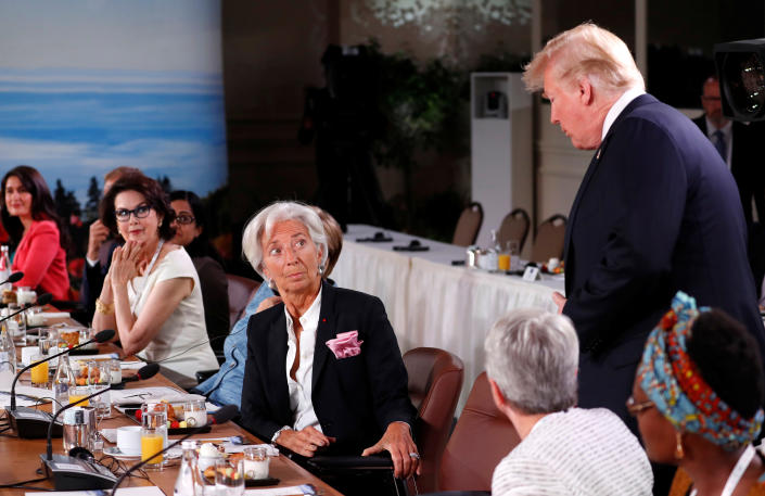 President Trump arrives as Managing Director of the International Monetary Fund, Christine Lagarde, looks up while they attend a G7 and Gender Equality Advisory Council meeting as part of the summit in Canada on June 9, 2018.