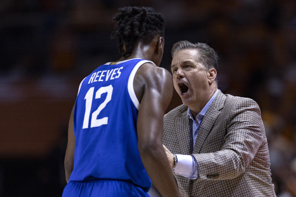 Kentucky head coach John Calipari, right, talks to guard Antonio Reeves (12) during the second half of an NCAA college basketball game against Tennessee, Saturday, March 9, 2024, in Knoxville, Tenn. (AP Photo/Wade Payne)