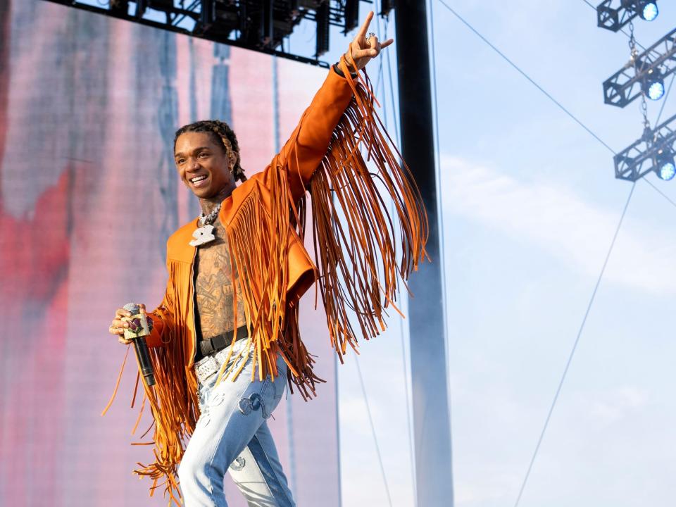 Swae Lee of Rae Sremmurd on stage at the Coachella wearing fringed jacket