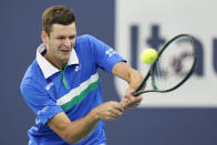 Hubert Hurkacz, of Poland, hits a backhand to Andrey Rublev, of Russia, during the Miami Open tennis tournament Friday, April 2, 2021, in Miami Gardens, Fla. (AP Photo/Wilfredo Lee)