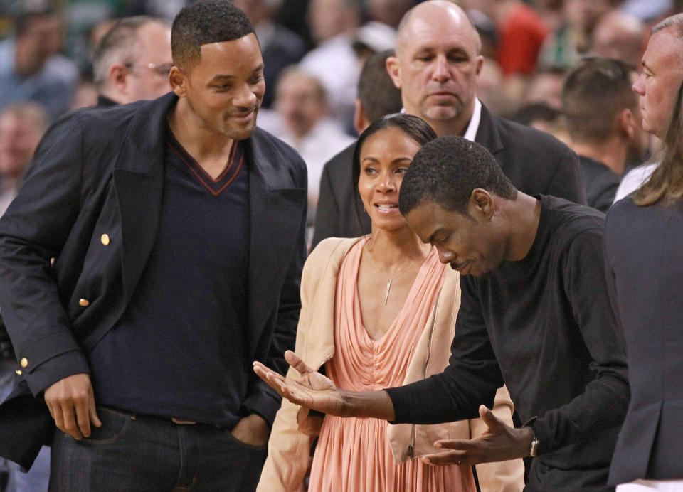 Boston, MA  -   Comedian/actor Chris Rock, right, chats with Will Smith and Jada Pinkett-Smith at Game 5 of the Eastern Conference Semifinals at TD Garden on Monday, May 21, 2012. Staff Photo by Matthew West.  (Photo by Matthew West/MediaNews Group/Boston Herald via Getty Images)