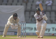 India's Mayank Agarwal plays shot during the day two of their second test cricket match with New Zealand in Mumbai, India, Saturday, Dec. 4, 2021.(AP Photo/Rafiq Maqbool)