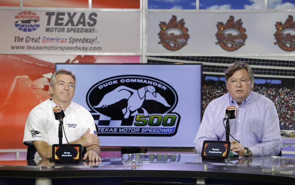 Greg Stucker, right, Goodyear director of race tire sales, and Robin Pemberton, NASCAR vice-president of competition and racing development, speak with reporters at Texas Motor Speedway in Fort Worth, Texas, Friday, April 4, 2014. NASCAR will not regulate tire pressures at the speedway, and if drivers have tire failures during Sunday's race officials believe they will not be able to blame Goodyear. (AP Photo/LM Otero)