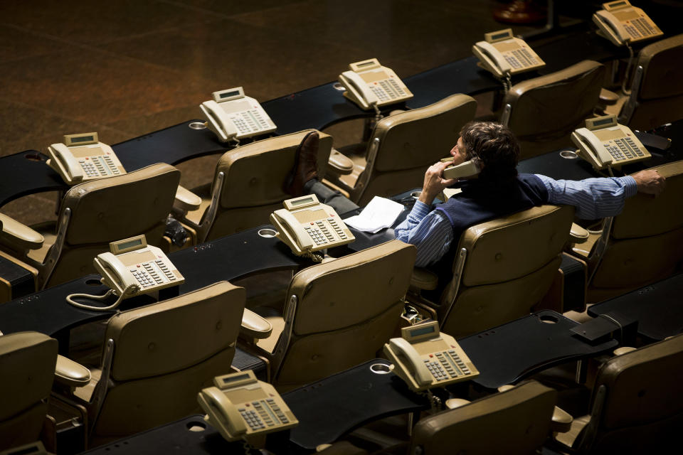 A broker works at the Buenos Aires Stock Exchange in Buenos Aires, Argentina, Tuesday, Oct. 23, 2012. Argentina's Merval stock market index dropped more than 3.5 percent Tuesday amid two new government efforts to control the country's economy. Argentina's President Cristina Fernandez says she'll ask Congress to put her government in charge of self-regulating stock and commodities markets, and she decreed that insurance companies must invest up to 30 percent of their holdings in "productive activities" to improve Argentina's infrastructure. (AP Photo/Victor R. Caivano)