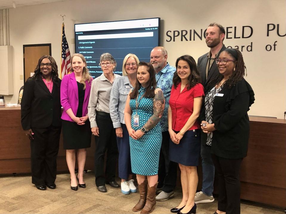 Superintendent Grenita Lathan, far left, takes a photo with school bus driver Olinda Osborn and board members Danielle Kincaid, Susan Provance, Judy Brunner, Steve Makoski, Maryam Mohammadkhani, Kelly Byrne and Shurita Thomas-Tate.