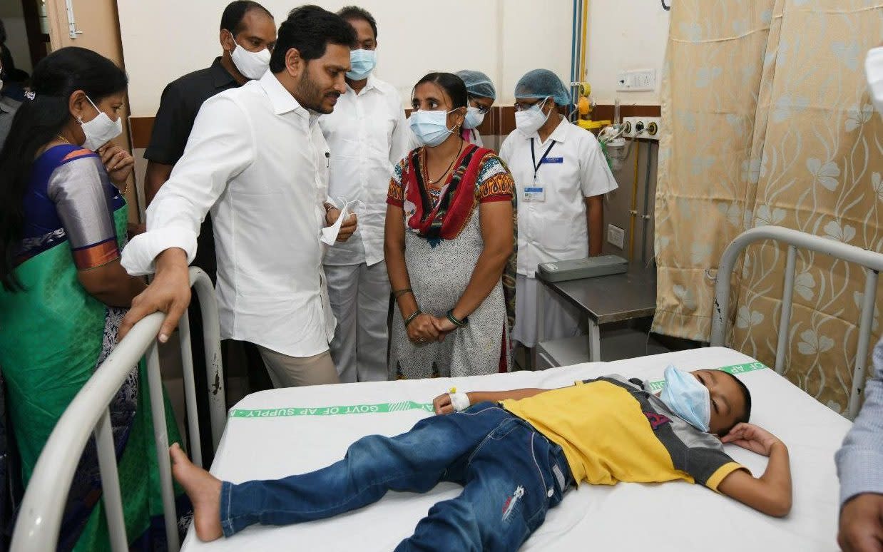 Andhra Pradesh Chief Minister Y.S. Jagan Mohan Reddy (C-L) meeting with the patients going under treatment for an unknown disease - STR HANDOUT/EPA-EFE/Shutterstock /Shutterstock