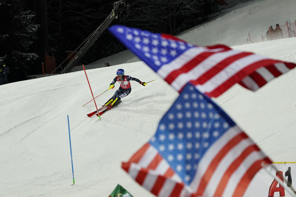 United States' Mikaela Shiffrin speeds down the course during an alpine ski, women's World Cup slalom in Flachau, Austria, Tuesday, Jan.10, 2023. American skier Mikaela Shiffrin finished second to Olympic champion Petra Vlhova in a night slalom race Tuesday, meaning she will have to wait for another chance to break the record for most wins on the women’s World Cup circuit. (AP Photo/Giovanni Auletta)