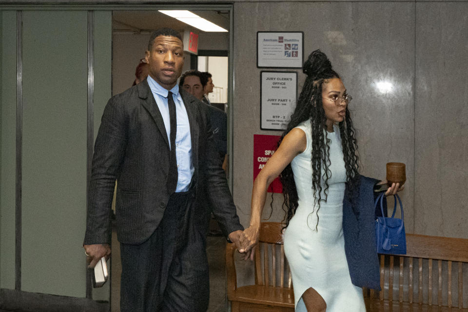 Jonathan Majors, left, accompanied by girlfriend Meagan Good, enters a courtroom at the Manhattan Criminal Courthouse in New York, Thursday, Dec. 14, 2023. (AP Photo/Peter K. Afriyie)