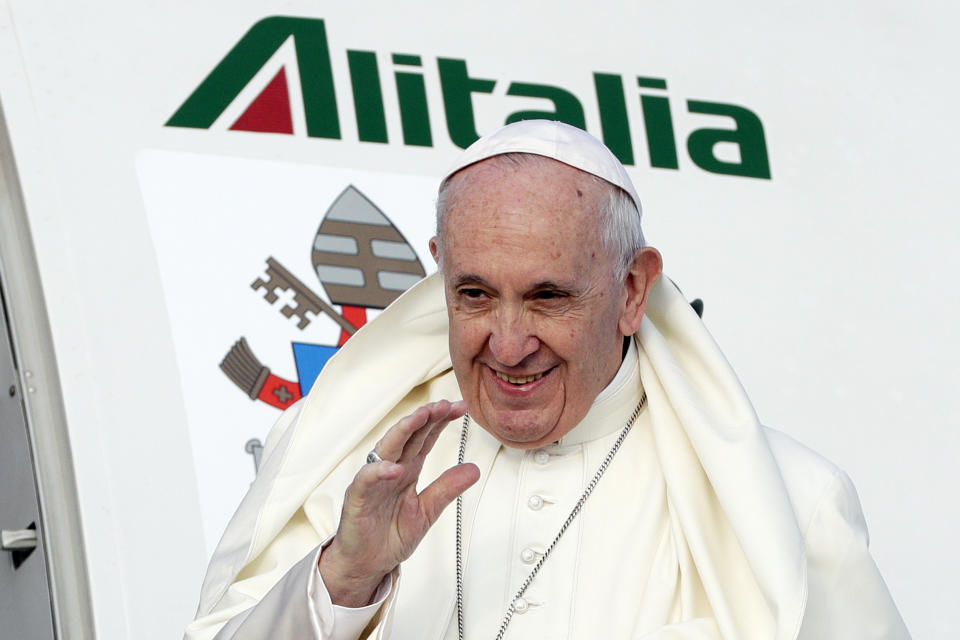 Pope Francis waves as he boards an airplane at Rome's Fiumicino international airport, Saturday, Aug. 25, 2018. The pontiff is traveling to Ireland for a two-day visit on the occasion of the 2018 World Meeting of Families. (AP Photo/Andrew Medichini)