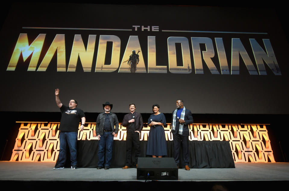 CHICAGO, IL - APRIL 14:  (L-R) Writer/executive producer Jon Favreau, Director/executive producer Dave Filoni, Pedro Pascal (The Mandalorian), Gina Carano (Cara Dune) and Carl Weathers (Greef) onstage during "The Mandalorian" panel at the Star Wars Celebration at McCormick Place Convention Center on April 14, 2019 in Chicago, Illinois.  (Photo by Daniel Boczarski/WireImage for Disney)