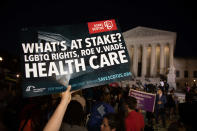 <p>Hundreds assembled in front of the U.S. Supreme Court in Washington D.C., to protest Brett Kavanaugh, President Donald Trump’s nominee to replace Justice Anthony Kennedy, on Monday night, July 9, 2018. ”What’s at stake? LGBTQ Rights, Roe V. Wade, Health Care” reads the sign. (Photo: Jeff Malet/Newscom via ZUMA Press) </p>