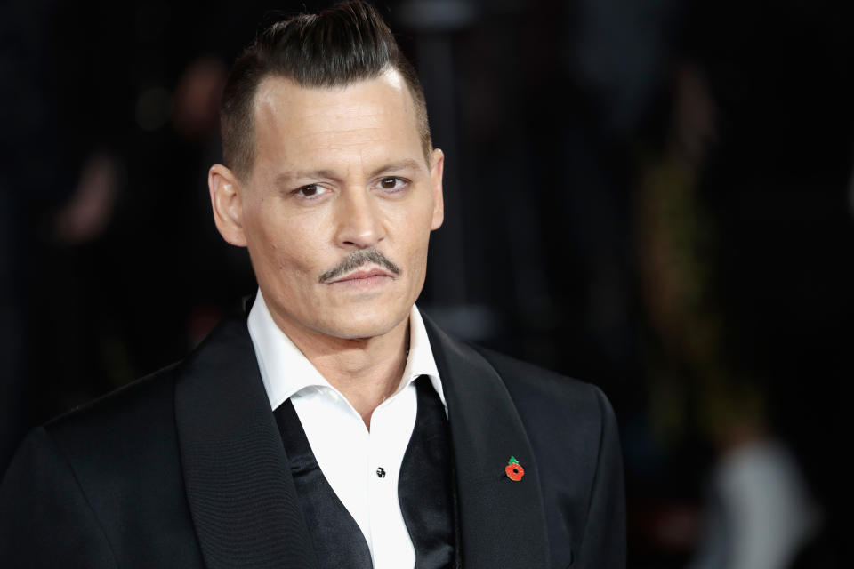 Johnn Depp was sued for allegedly punching a crew member on the set of his Notorious BIG film City of Lies