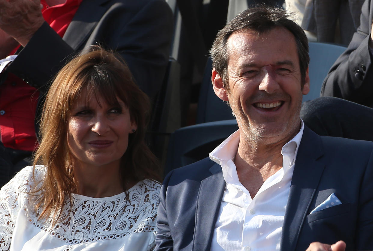 PARIS, FRANCE - MAY 31: Jean-Luc Reichmann and his wife Nathalie Reichmann cheer for Gael Monfils on Day 7 of the French Open 2014 held at Roland-Garros stadium on May 31, 2014 in Paris, France. (Photo by Jean Catuffe/Getty Images)