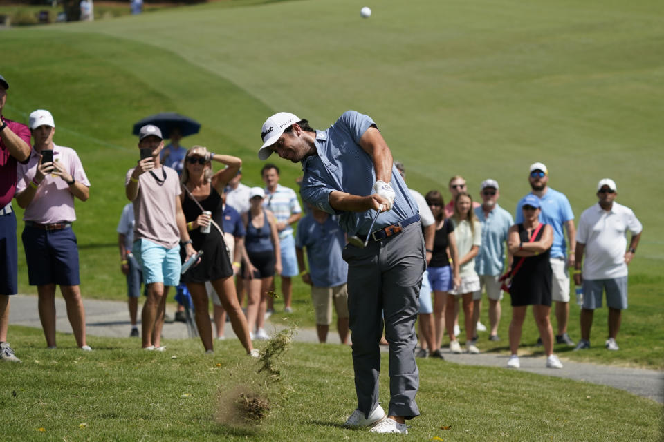 Davis Riley hits to the ninth hole during the third round of the Wyndham Championship golf tournament in Greensboro, N.C., Saturday, Aug. 6, 2022. (AP Photo/Chuck Burton)