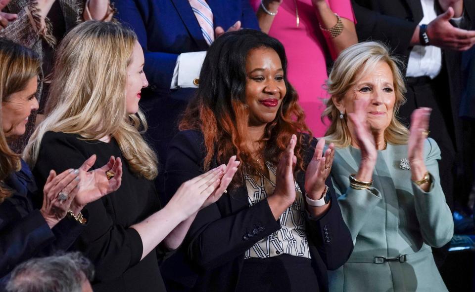 Maria Shriver (L), Kate Cox (2nd L), who was denied emergency abortion care by the Texas Supreme Court, and US First Lady Jill Biden (R) applaud Latorya Beasley (2nd R), who recently had an IVF embryo transfer cancelled following the result of a recent Alabama Supreme Court decision during State of the Union address on March 7, 2024.