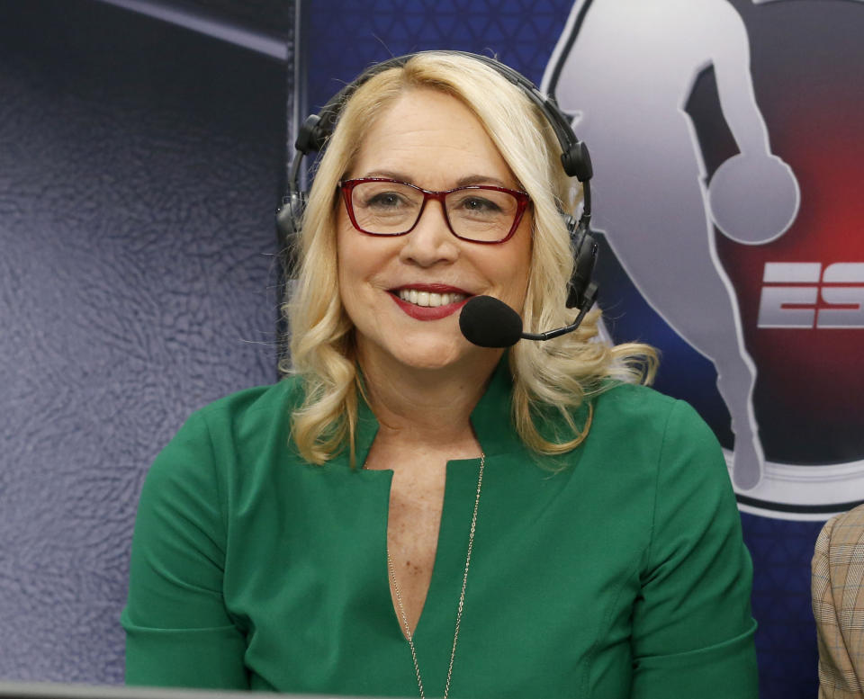 FILE - NBA ESPN announcer Doris Burke looks on before an NBA basketball game between the New Orleans Pelicans and the Dallas Mavericks in Dallas, March 4, 2020. ESPN let NBA analyst Mark Jackson go Monday, July 31, 2023, with two years remaining on his contract. With Jeff Van Gundy also being laid off in late June, ESPN is expected to replace them with Burke and Doc Rivers, people close to the move told The Associated Press. (AP Photo/Michael Ainsworth, File)