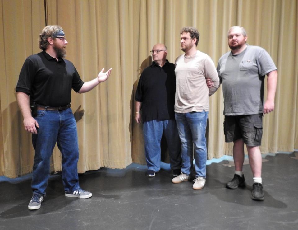 Andrew Servais as Judas, Heath Chaney as Jesus and Lynn Haines and Shaun Sees as guards rehearse a scene from "Jesus Christ Superstar" opening at the Triple Locks Theater by the Coshocton Footlight Players.