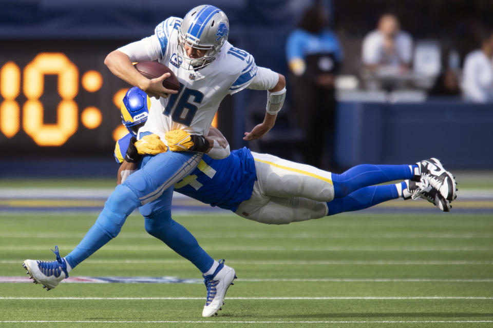 Detroit Lions quarterback Jared Goff (16) is tackled by Los Angeles Rams inside linebacker Kenny Young (41) in the second half of an NFL football game in Inglewood, Calif., Sunday, Oct. 24, 2021. The injury-riddled Denver Broncos acquired inside linebacker Kenny Young from the Los Angeles Rams on Monday, Oct. 25, 2021, four days after they were gouged by third-string Cleveland running back De'Ernest Johnson.(AP Photo/John McCoy)