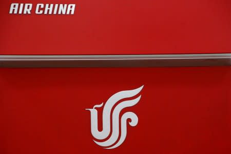 FILE PHOTO: Air China's logo is seen on a counter of Air China at a terminal of Beijing Capital International Airport in Beijing