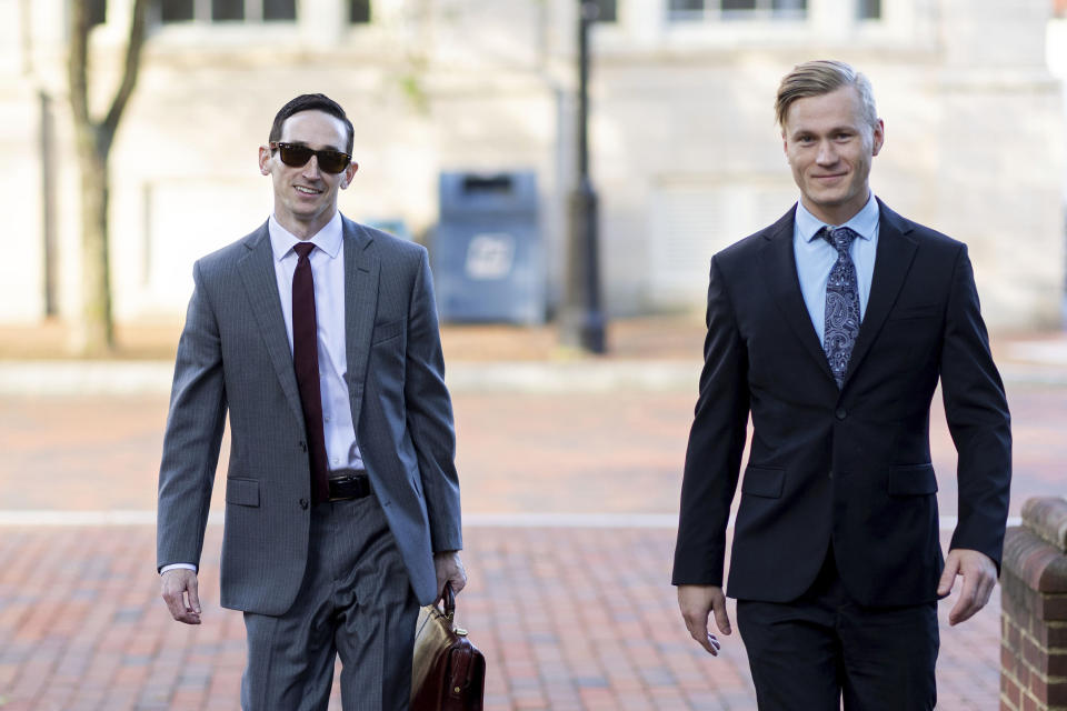 Peter Frazier and Jacob Joseph Dix arrive at the Albemarle County Circuit Court in Charlottesville, Va., Tuesday, June 4, 2024. Years after a white nationalist rally erupted in violence in Charlottesville, a trial is set to begin Tuesday for Dix ,one of the people charged with using flaming torches to intimidate counterprotesters. (AP Photo/Ryan M. Kelly)