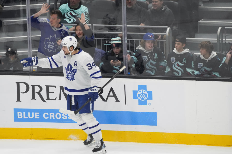 Toronto Maple Leafs center Auston Matthews (34) celebrates after scoring against the Seattle Kraken during the first period of an NHL hockey game Sunday, Jan. 21, 2024, in Seattle. (AP Photo/Lindsey Wasson)