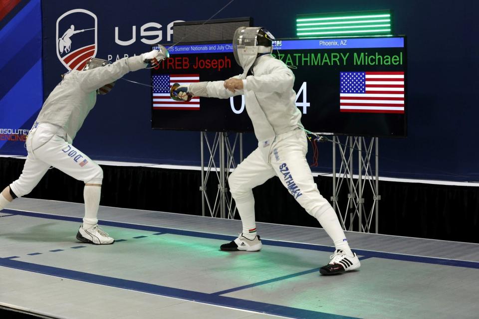 Mike Szathmary is shown competing in the USA Fencing national championships earlier this summer on his way to the title in his age division. He competes with the sabre, which he considers "the prettiest weapon to watch."