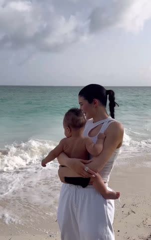 <p>Kylie Jenner Instagram</p> Kylie Jenner holding her son Aire Webster on the beach