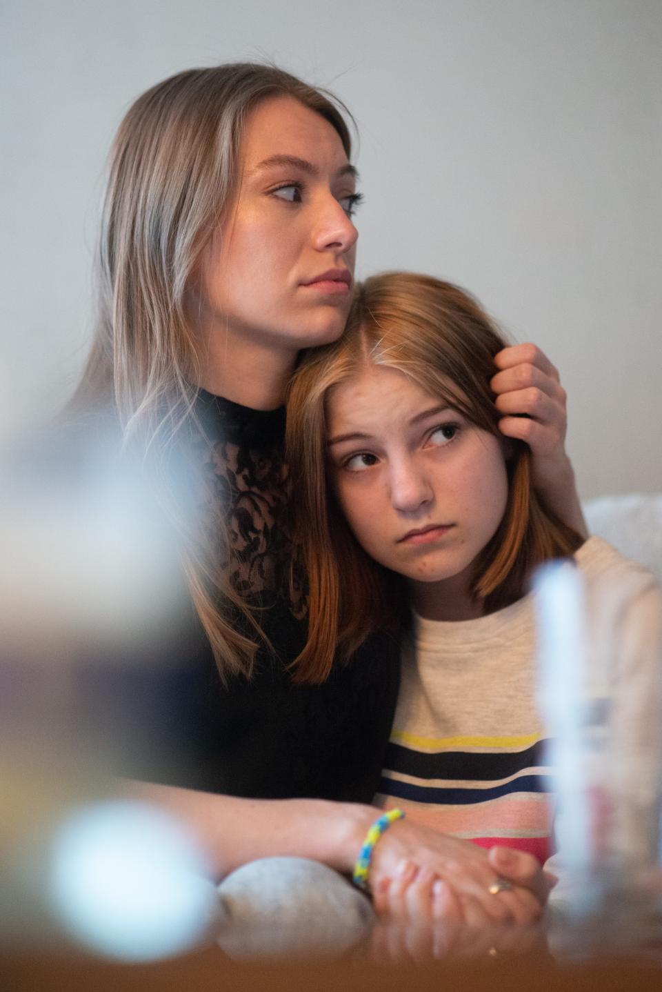 In this photo vocalist Mariia Ratman, left, comforts her sister Daria Ratman shortly after fleeing Ukraine. Mariia Ratman, will perform in Ukrainian and English at a concert Sunday.