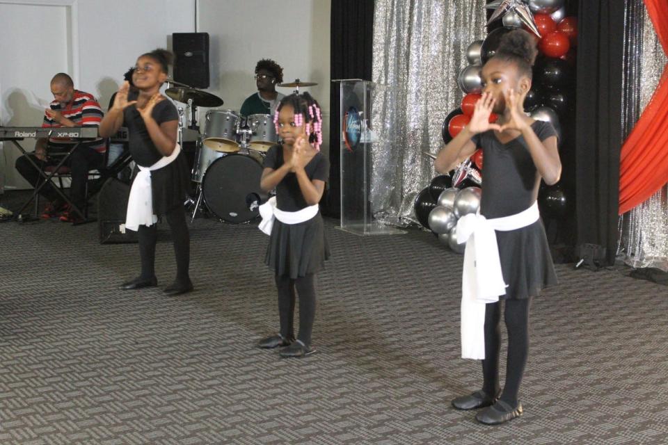 The younger group of The Atmosphere Shifters liturgical dance group perform during the service.