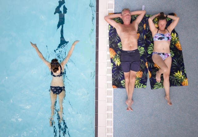 People enjoy the hot weather at Hathersage open air swimming pool at Hope Valley, near Sheffield