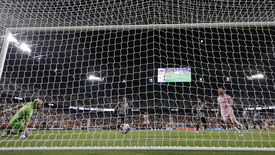 Inter Miami forward Lionel Messi, right, scores a goal against the New York Red Bulls during an MLS soccer match at Red Bull Arena, Saturday, Aug. 26, 2023, in Harrison, N.J. (AP Photo/Eduardo Munoz Alvarez)