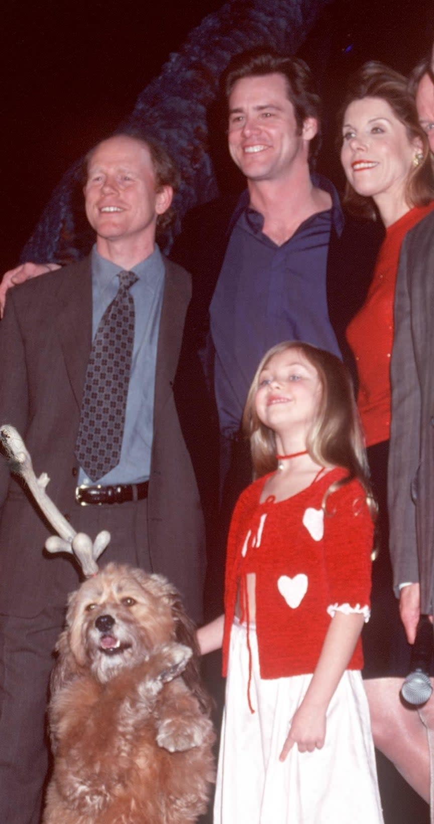 Close-up of Taylor smiling with Jim and other movie costars