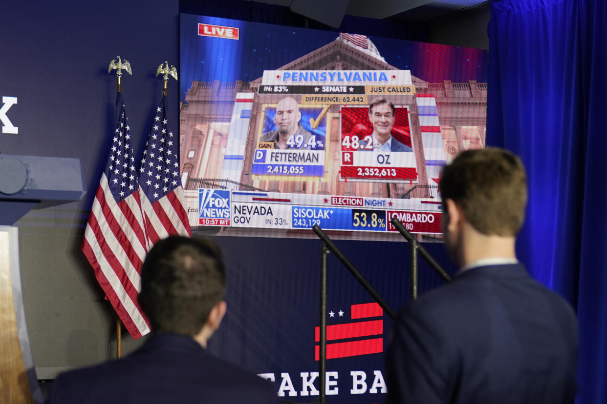 A cable network television broadcast displays information during the evening on the Pennsylvania Senate race with Democrat John Fetterman and Republican Dr. Mehmet Oz, at a hotel, Wednesday, Nov. 9, 2022, in Washington. (AP Photo/Alex Brandon)