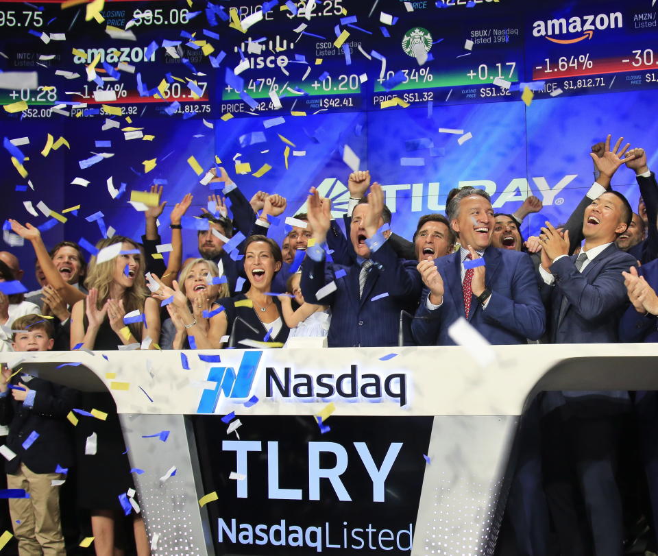 FILE- In this July 19, 2018, file photo Brendan Kennedy, third from right in front, CEO and founder of British Columbia-based Tilray Inc. (AP Photo/Bebeto Matthews, File)