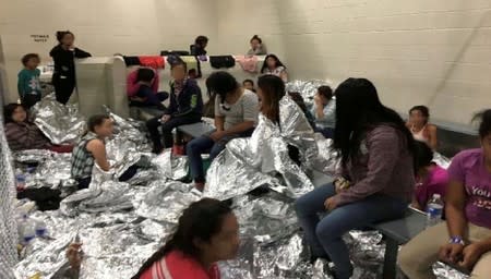 An overcrowded area holding families at a Border Patrol Centralized Processing Center is seen in McAllen