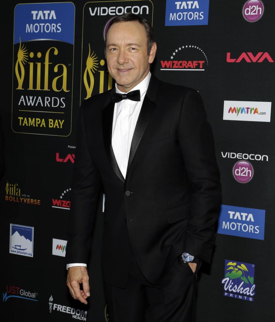 Actor Kevin Spacey poses for photographers as he walks the green carpet after arriving for 15th annual International Indian Film Awards Saturday, April 26, 2014, in Tampa, Fla. (AP Photo/Chris O'Meara)
