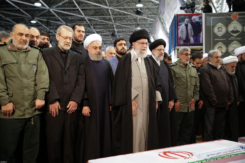 Iran's supreme leader leads prayer over the caskets of Iranian military commander Qasem Soleimani and Iraqi paramilitary chief Abu Mahdi al-Muhandis, both killed in the US strike (KHAMENEI.IR/AFP via Getty Images)