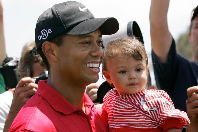 <p>AP Photo/Charlie Riedel</p> Tiger Woods and Sam Woods in 2008
