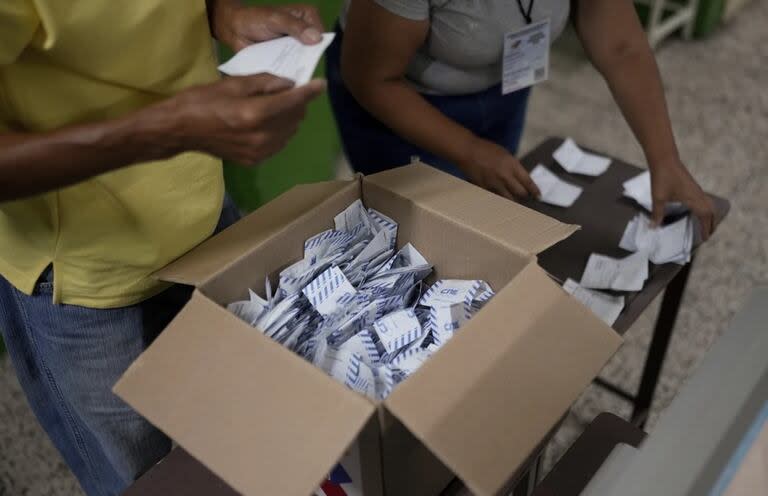 Opposition leader Maria Corina Machado, left, and opposition candidate Edmundo Gonzalez hold up vote tally sheets from the top of a truck during a protest against the official presidential election results declaring President Nicolas Maduro the winner in Caracas, Venezuela, Tuesday, July 30, 2024, two days after the election. (AP Photo/Cristian Hernandez)