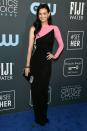 <p>Lydia Hearst smiles in a black-and-pink number.</p>