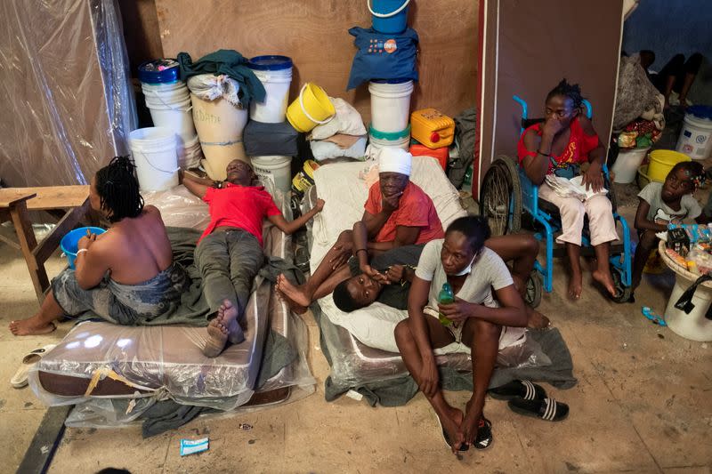 People shelter inside a school after their settlement was burned down by gangs in Port-au-Prince