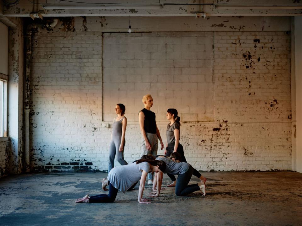 New Industry Dance presents the new work "throughspace" on March 23-25, 2023, at EM EN Studios in downtown South Bend. Standing are Sharon Sims, left, Michael McMillion and Elyse Paul.