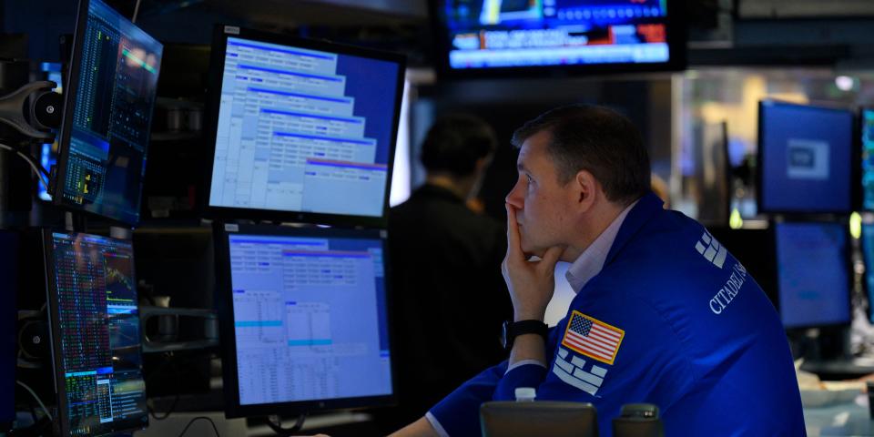 A trader works on the floor of the New York Stock Exchange (NYSE) at the opening bell on August 5, 2022 at Wall Street in New York City.